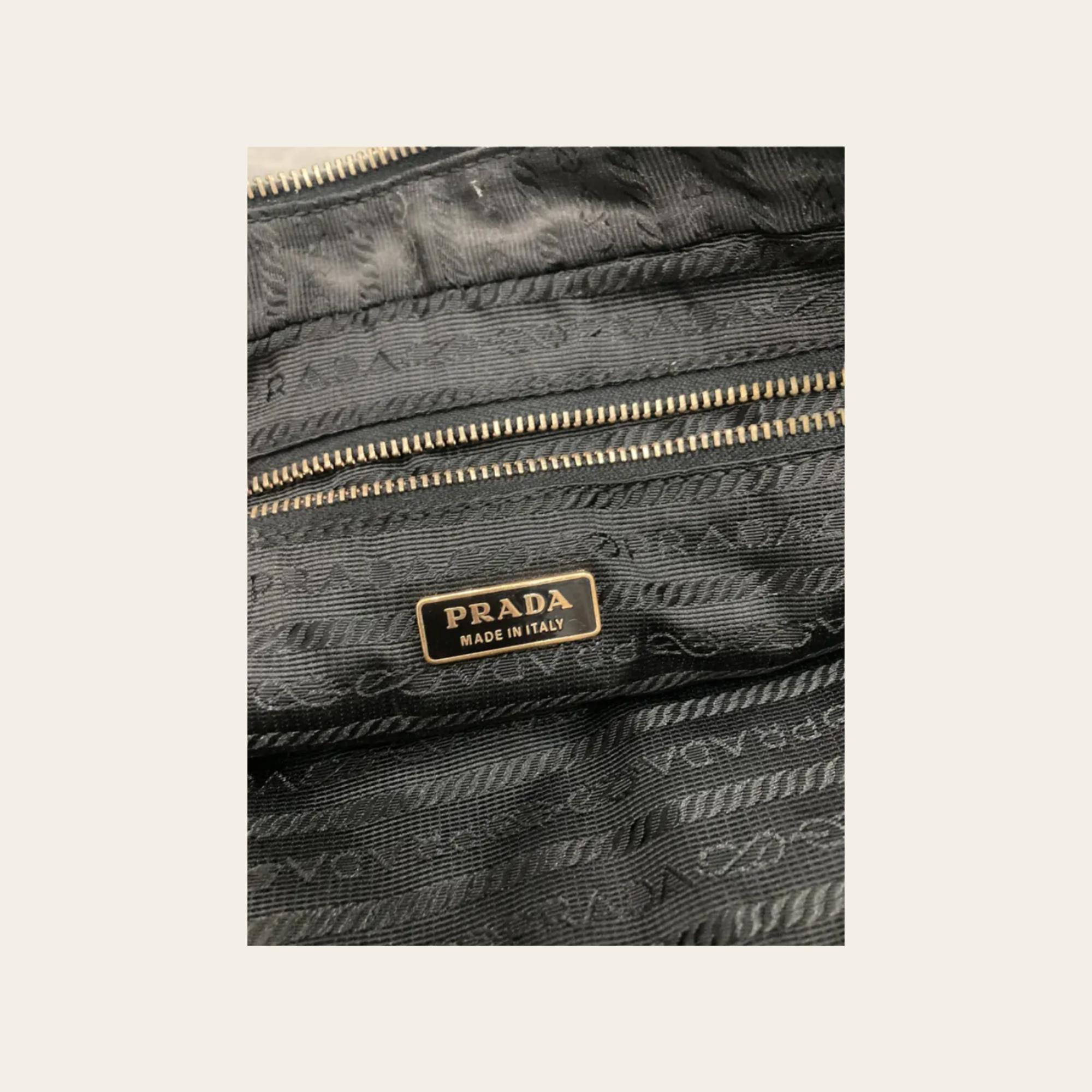 Prada - Vitello Grommet Baguette Bag