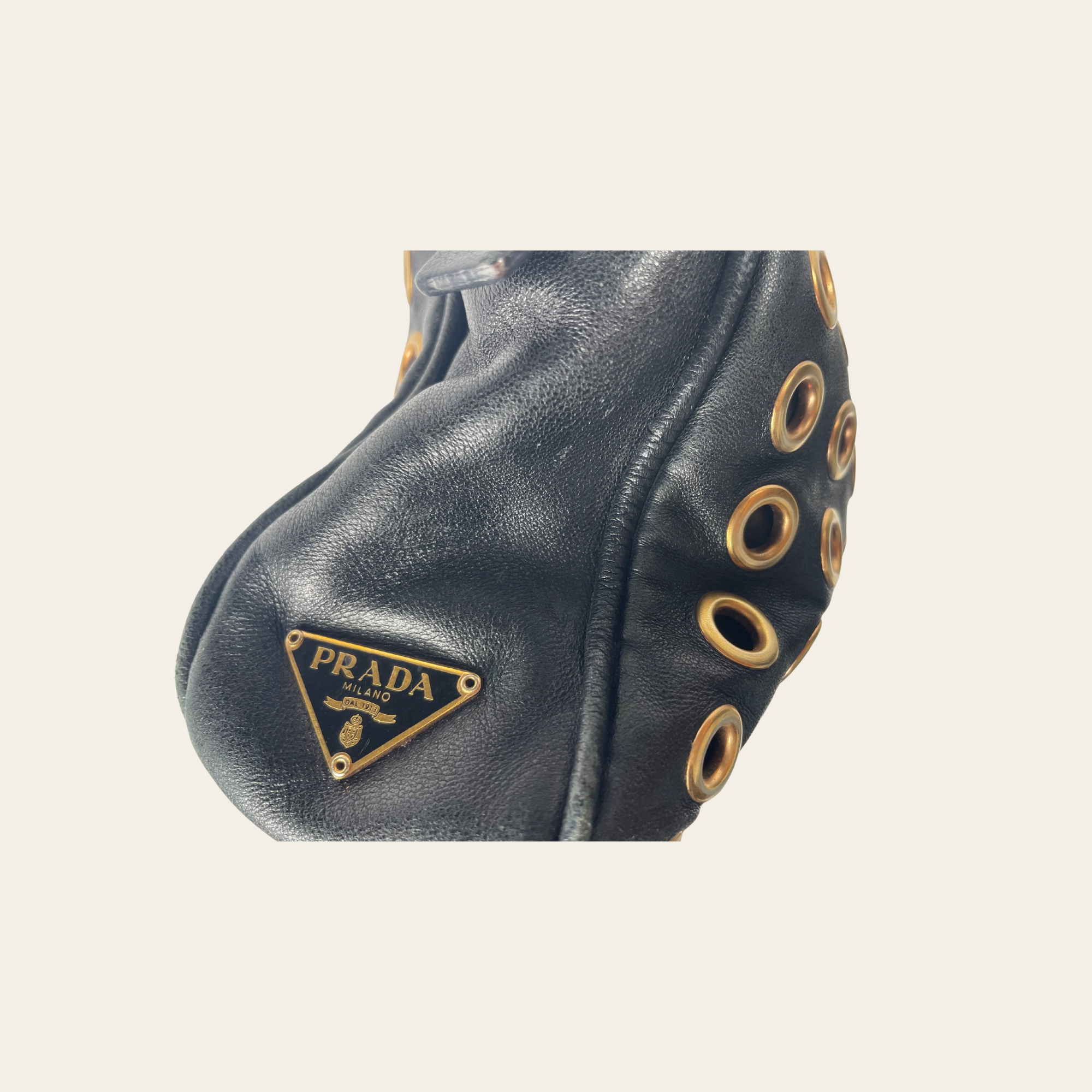 Prada - Vitello Grommet Baguette Bag