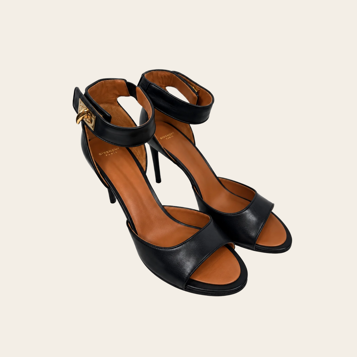 GIVENCHY — Sandales Shark Lock en cuir noir à talons aiguilles et brides de cheville à fermoirs dorés, taille 39½