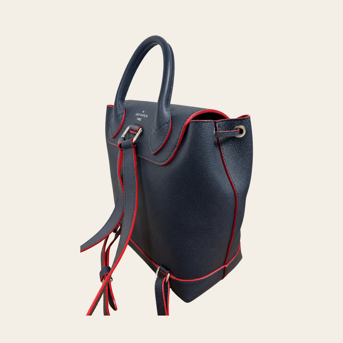 LOUIS VUITTON — Sac à dos Lockme en cuir grainé bleu marine et rouge