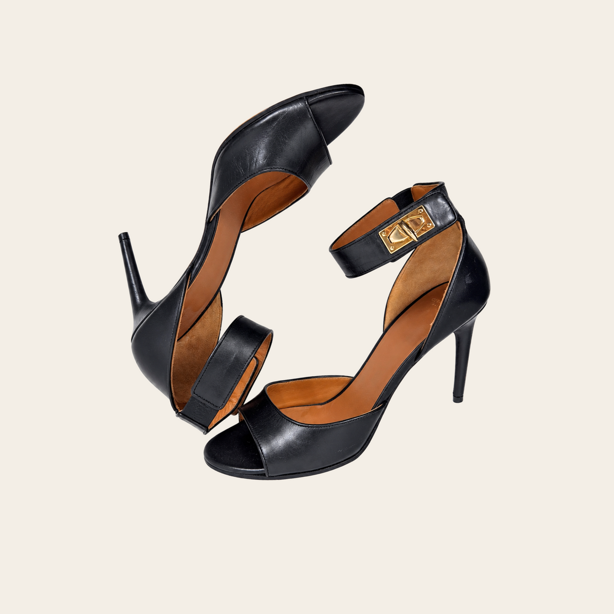 GIVENCHY — Sandales Shark Lock en cuir noir à talons aiguilles et brides de cheville à fermoirs dorés, taille 39½