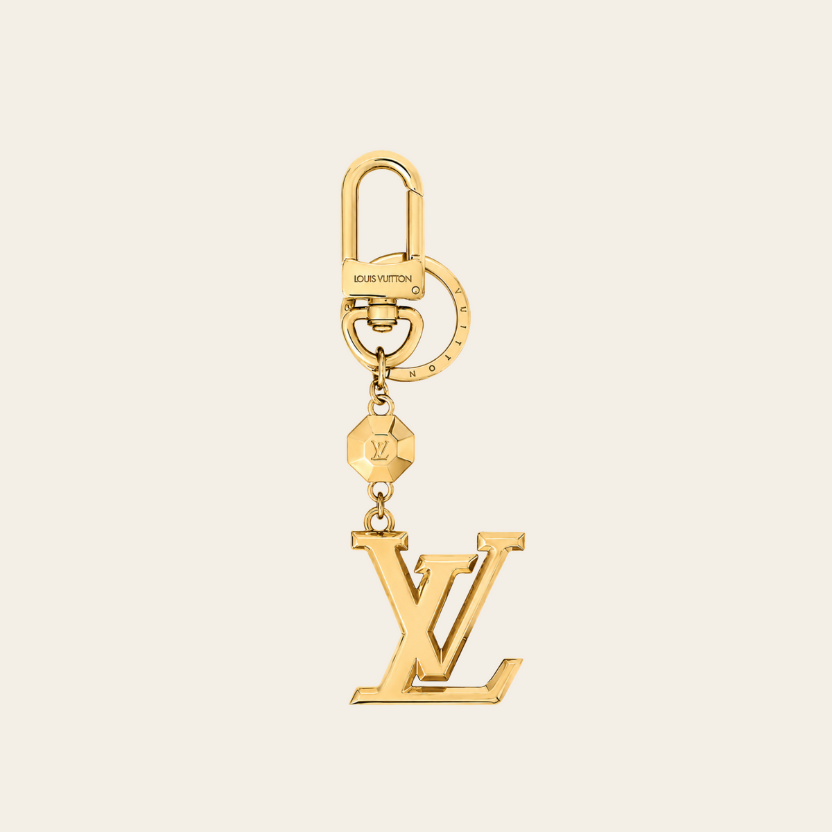 LOUIS VUITTON — Porte-clés et bijou de sac LV Facettes en métal doré