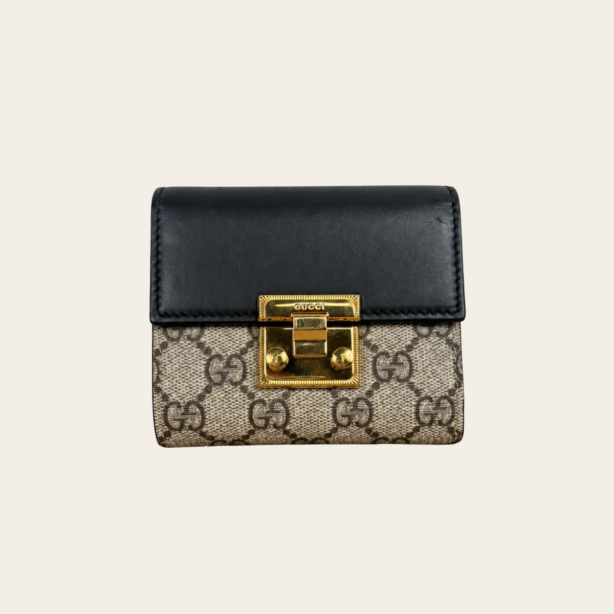 GUCCI — Portefeuille compact GG Supreme Padlock en toile beige et cuir noir