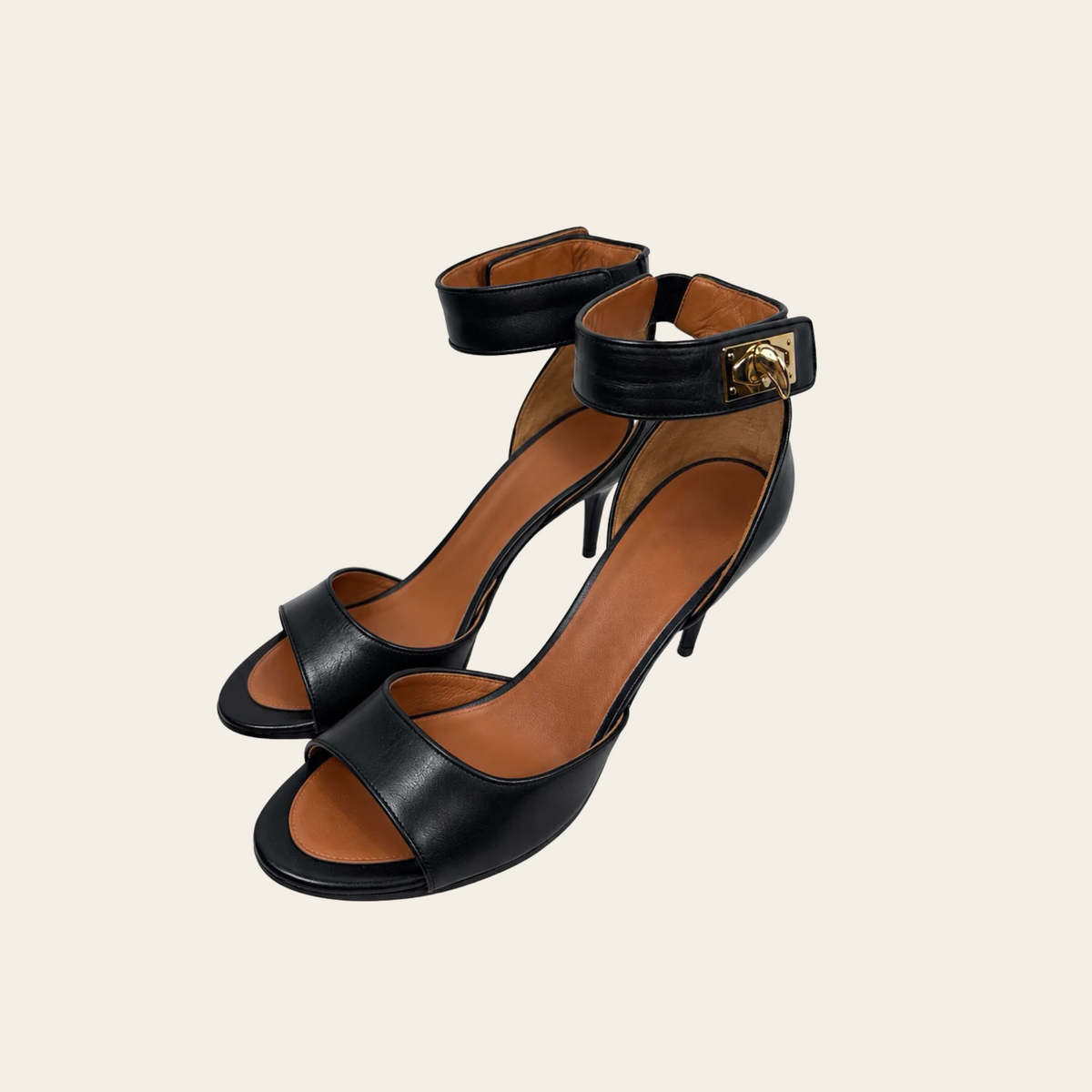 GIVENCHY — Sandales Shark Lock en cuir noir à talons aiguilles et brides de cheville à fermoirs dorés, taille 39½