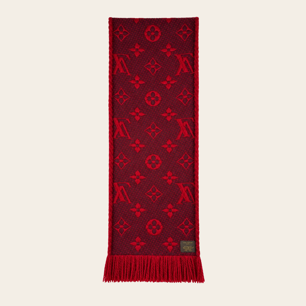 LOUIS VUITTON — Écharpe Logomania en laine et soie rouge rubis à motif Monogram jacquard et franges