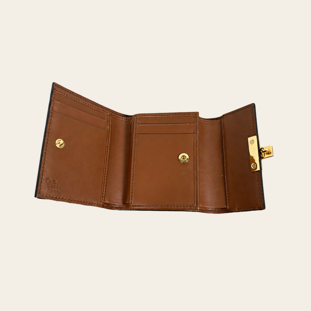 GUCCI — Portefeuille compact GG Supreme Padlock en toile beige et cuir noir