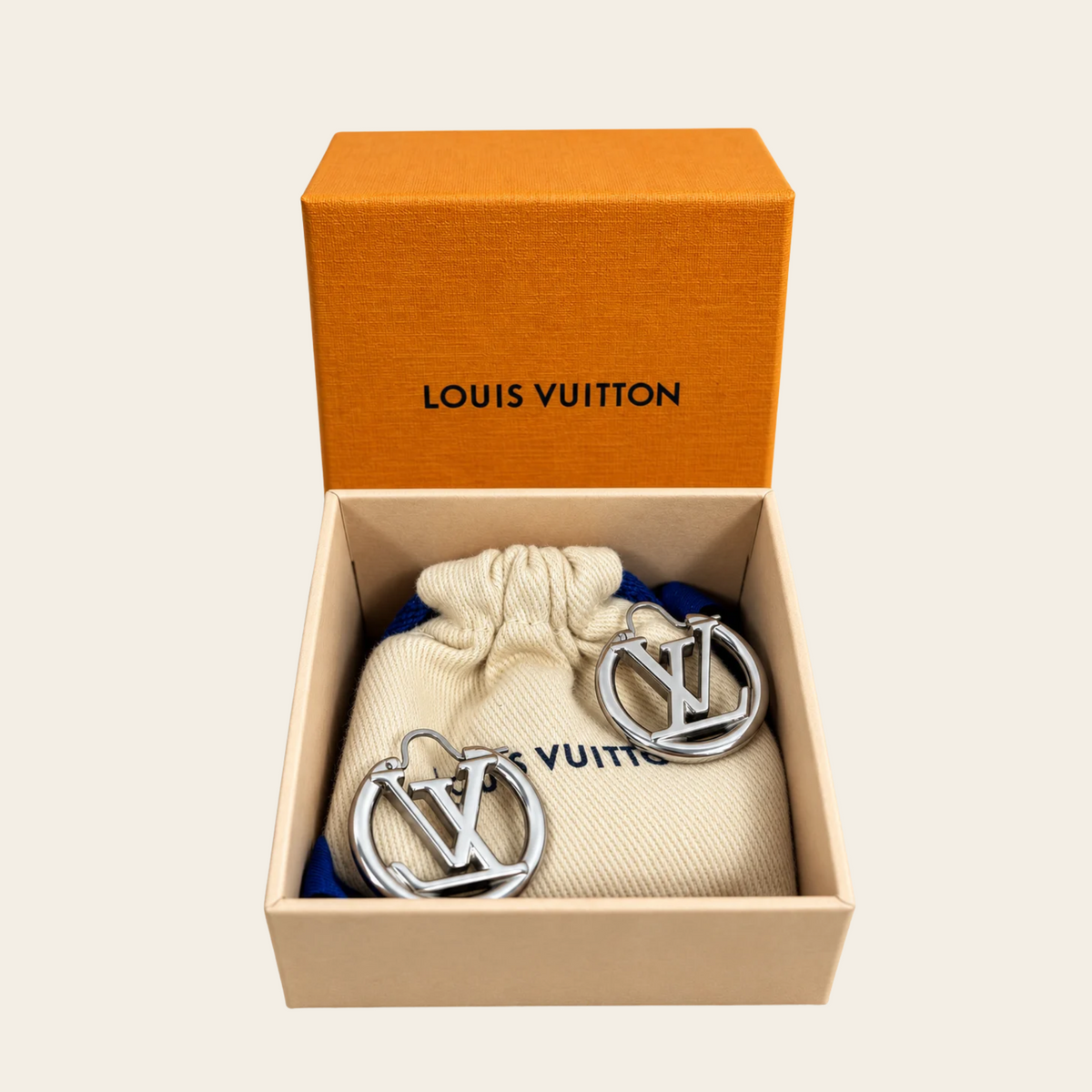 LOUIS VUITTON — Boucles d’oreilles créoles Louise, finition palladium argentée