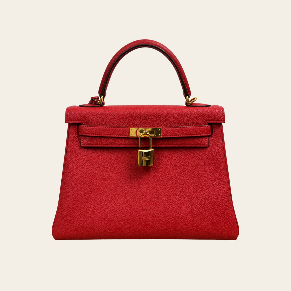 HERMÈS — Kelly 25 Retourne en cuir Togo rouge, quincaillerie dorée