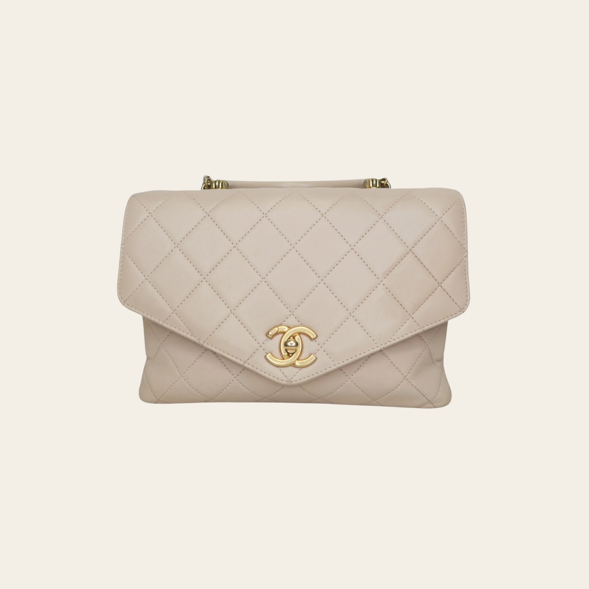 Chanel – Sac Coco Handle CC Top Handle en cuir matelassé beige