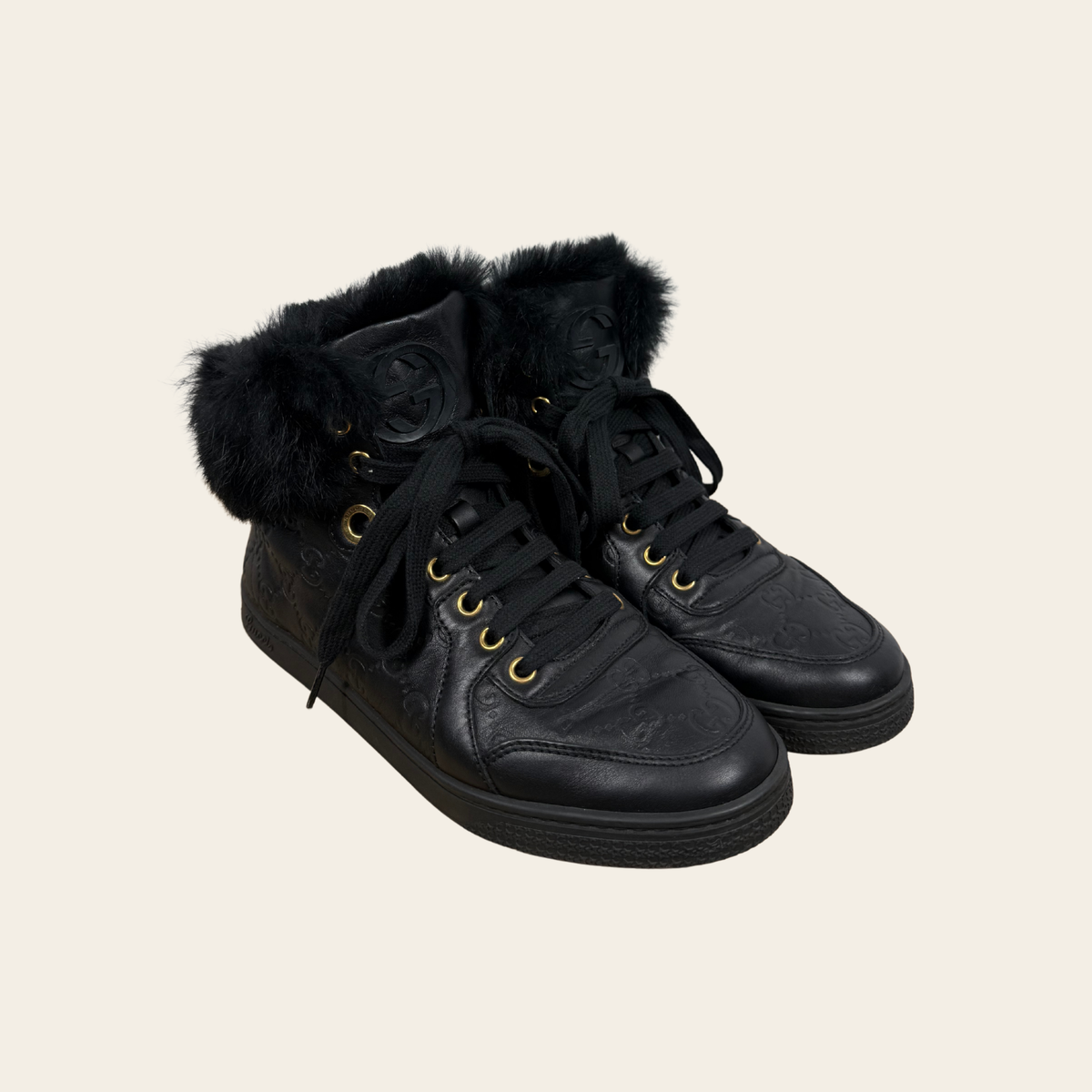 GUCCI — Sneakers montantes Guccissima en cuir noir avec fourrure, Taille 36½