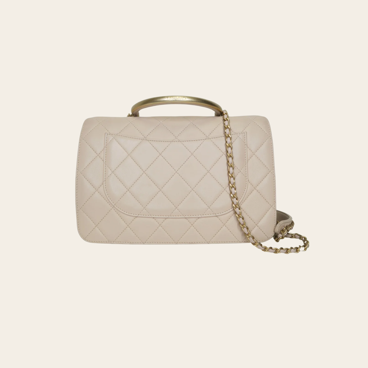 Chanel – Sac Coco Handle CC Top Handle en cuir matelassé beige