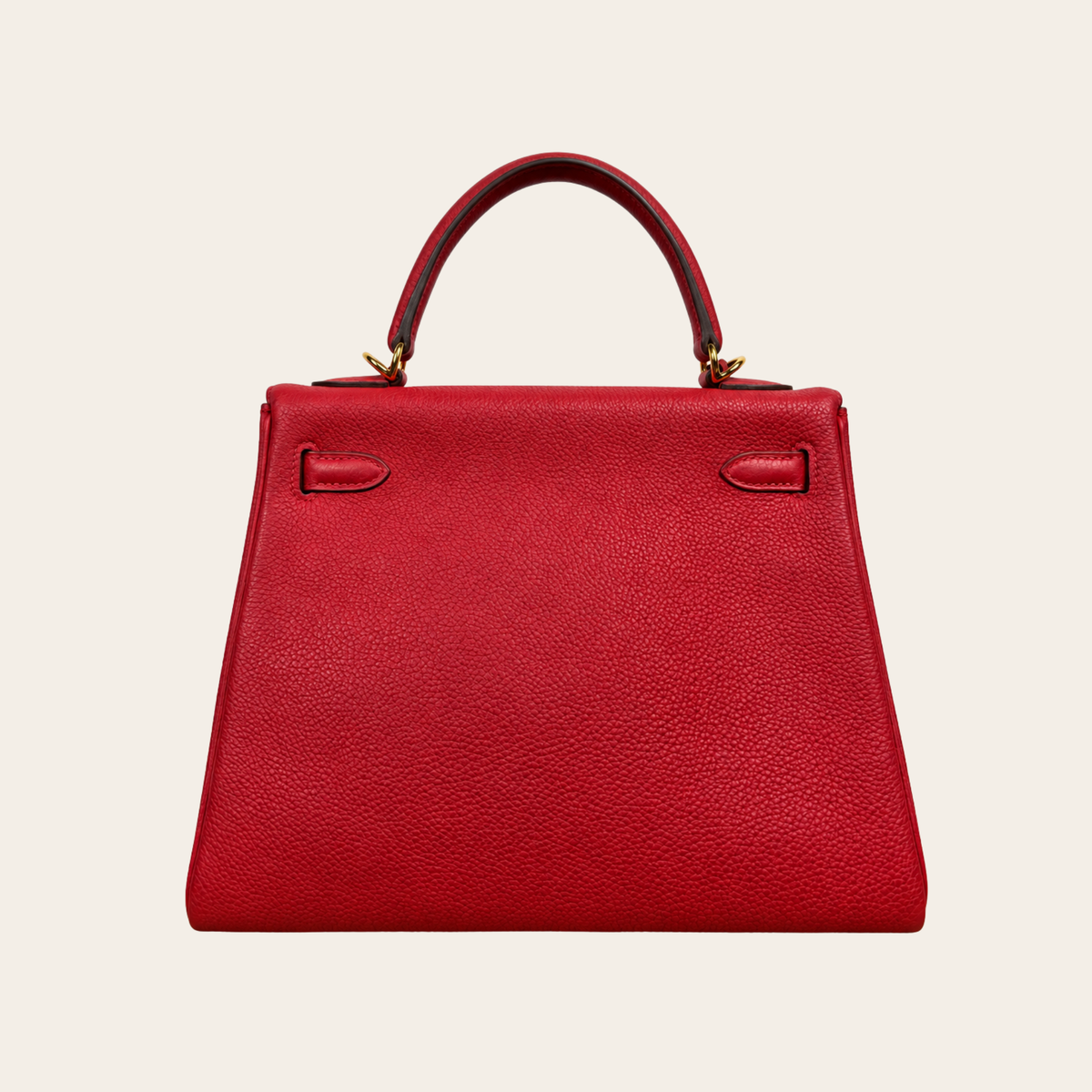 HERMÈS — Kelly 25 Retourne en cuir Togo rouge, quincaillerie dorée
