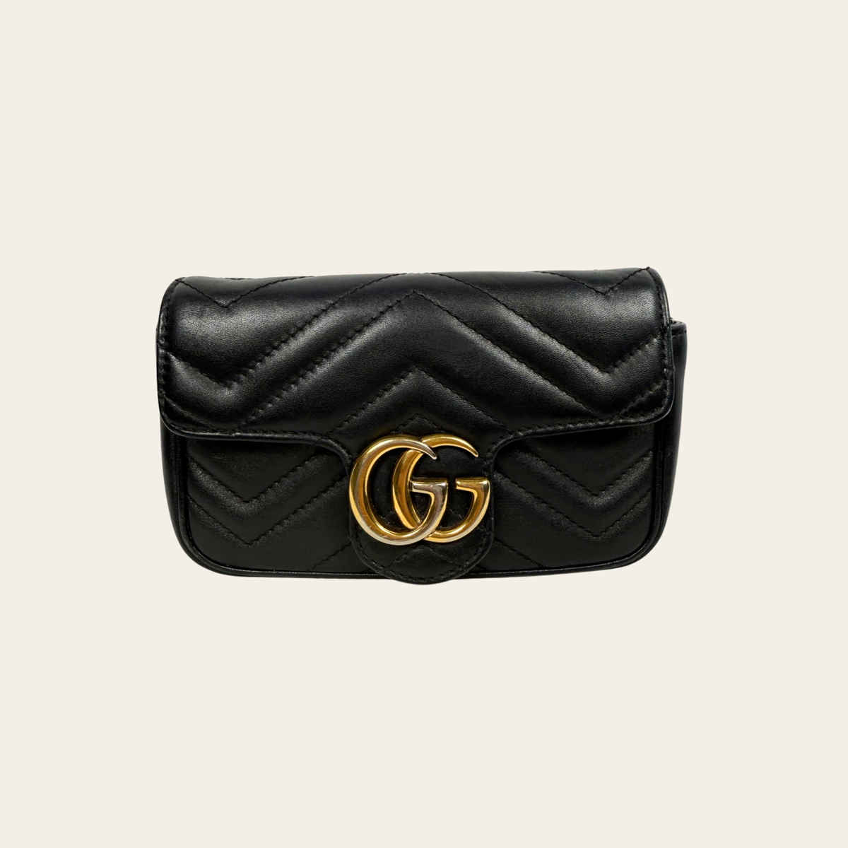 GUCCI — Sac GG Marmont Super Mini en cuir matelassé noir
